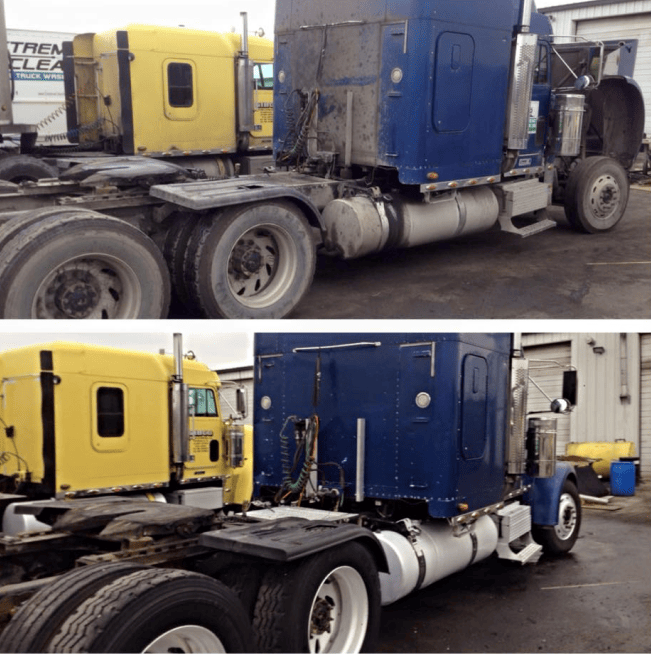Two semi trucks, one yellow and one blue, parked side by side in an industrial lot with wet pavement.